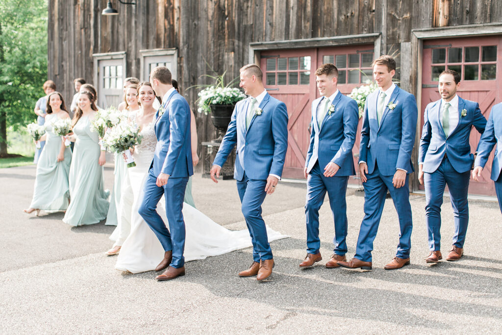 Wedding Party photo with rustic barn in background at Lion Rock Farm wedding
