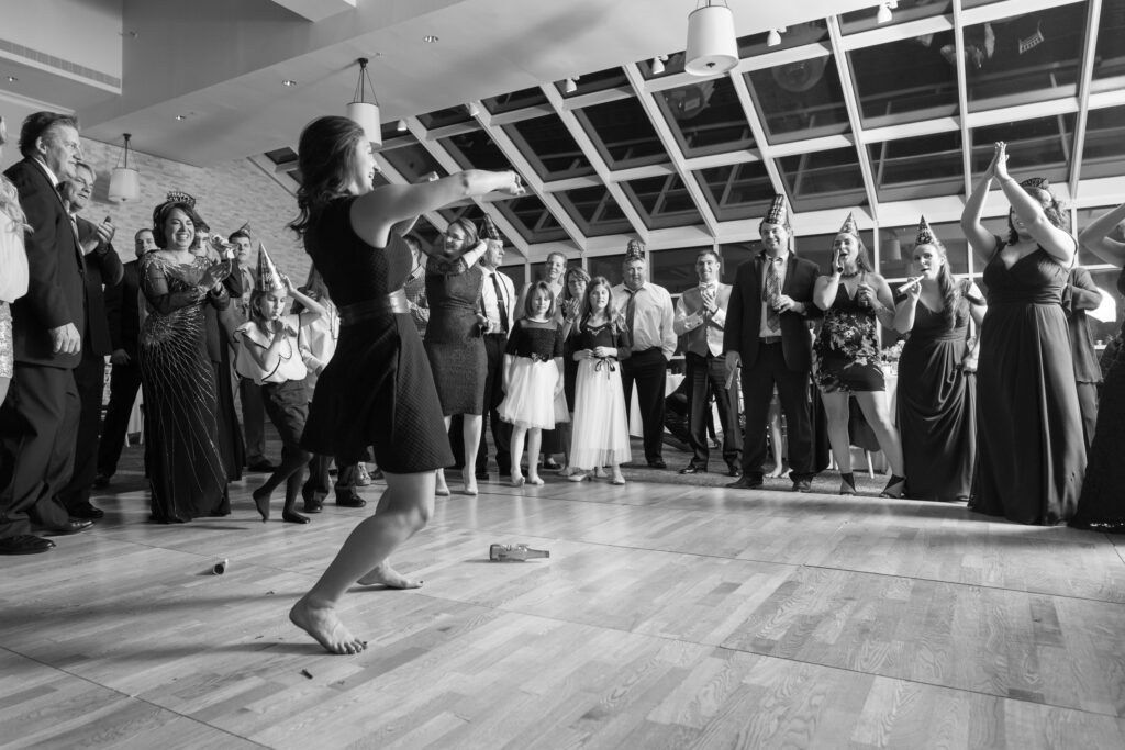 New Years Eve Wedding Dancefloor woman dancing black and white during reception at Westport Inn wedding