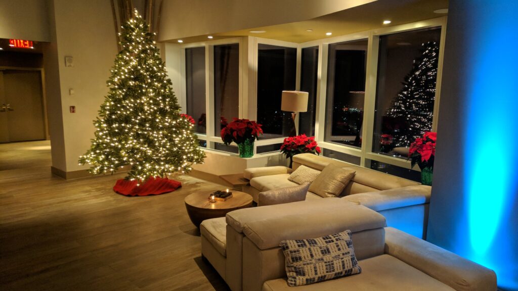 Christmas Tree Lounge with blue uplighting at Ritz-Carlton Westchester Holiday Parties NY