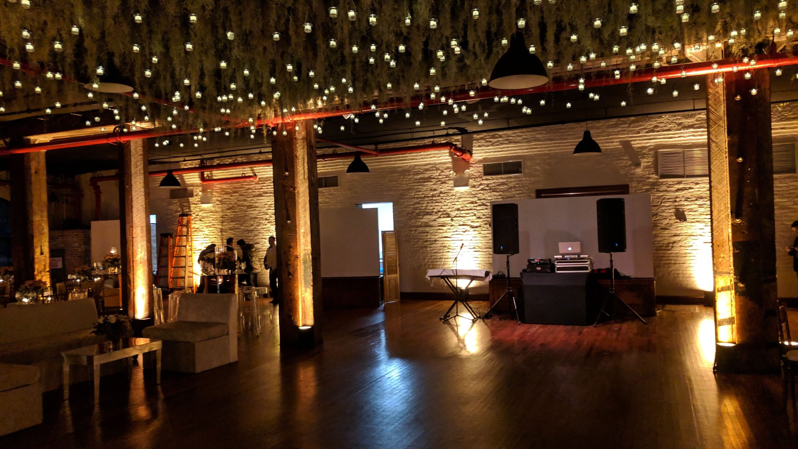 Rustic dancefloor before wedding reception with uplighting at the Liberty Warehouse in Brooklyn NY