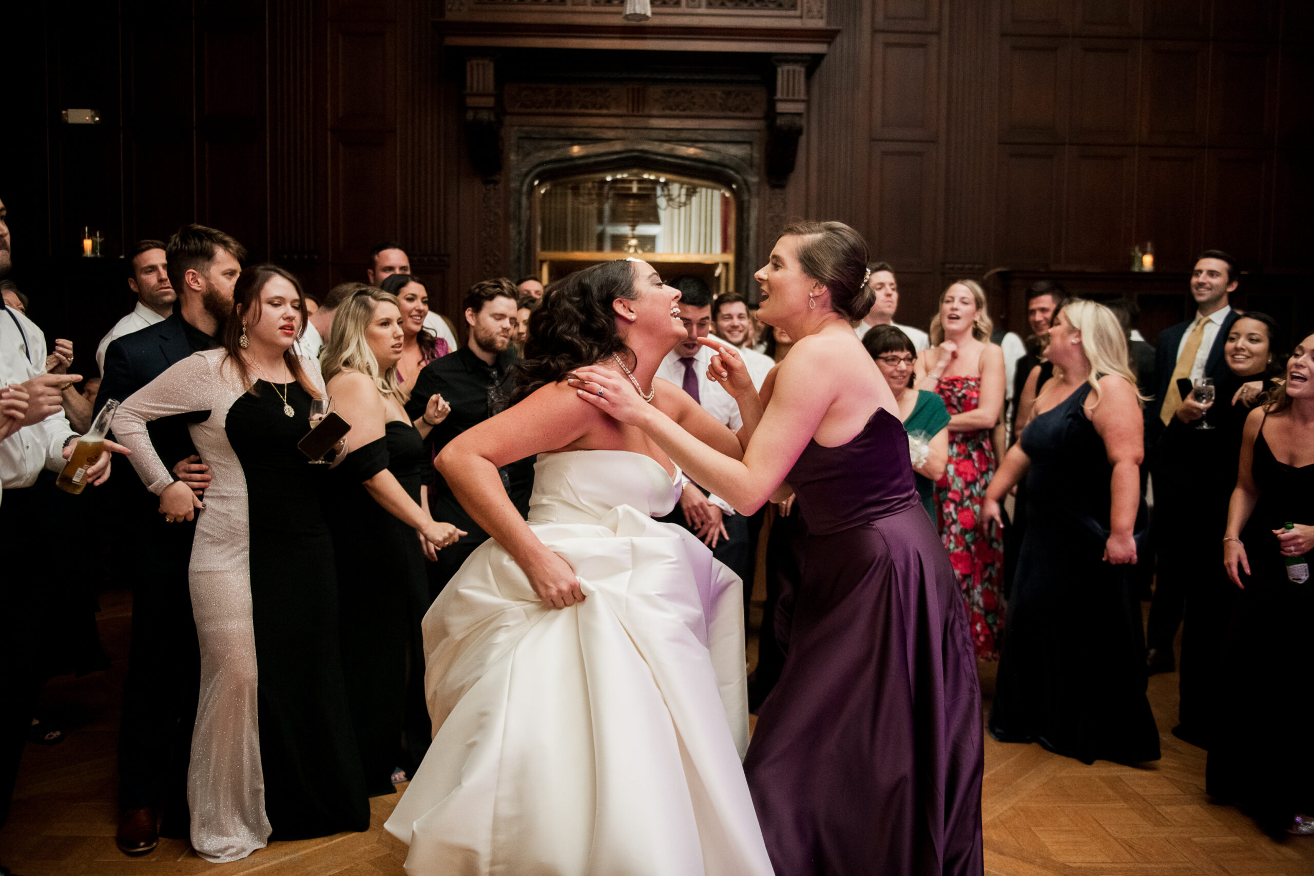 reid castle wedding in purchase ny bride and bridesmaid dancing