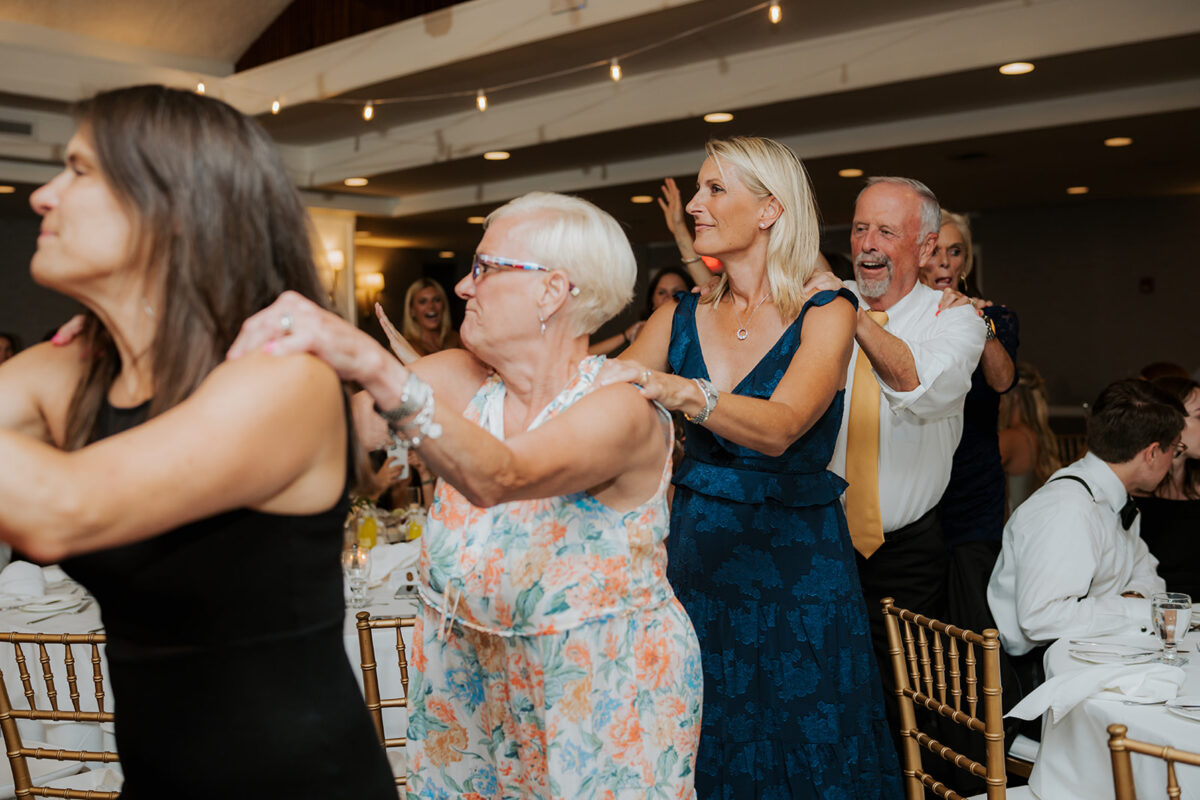 Waters Edge Wedding Venue, Westbrook CT conga line at wedding reception