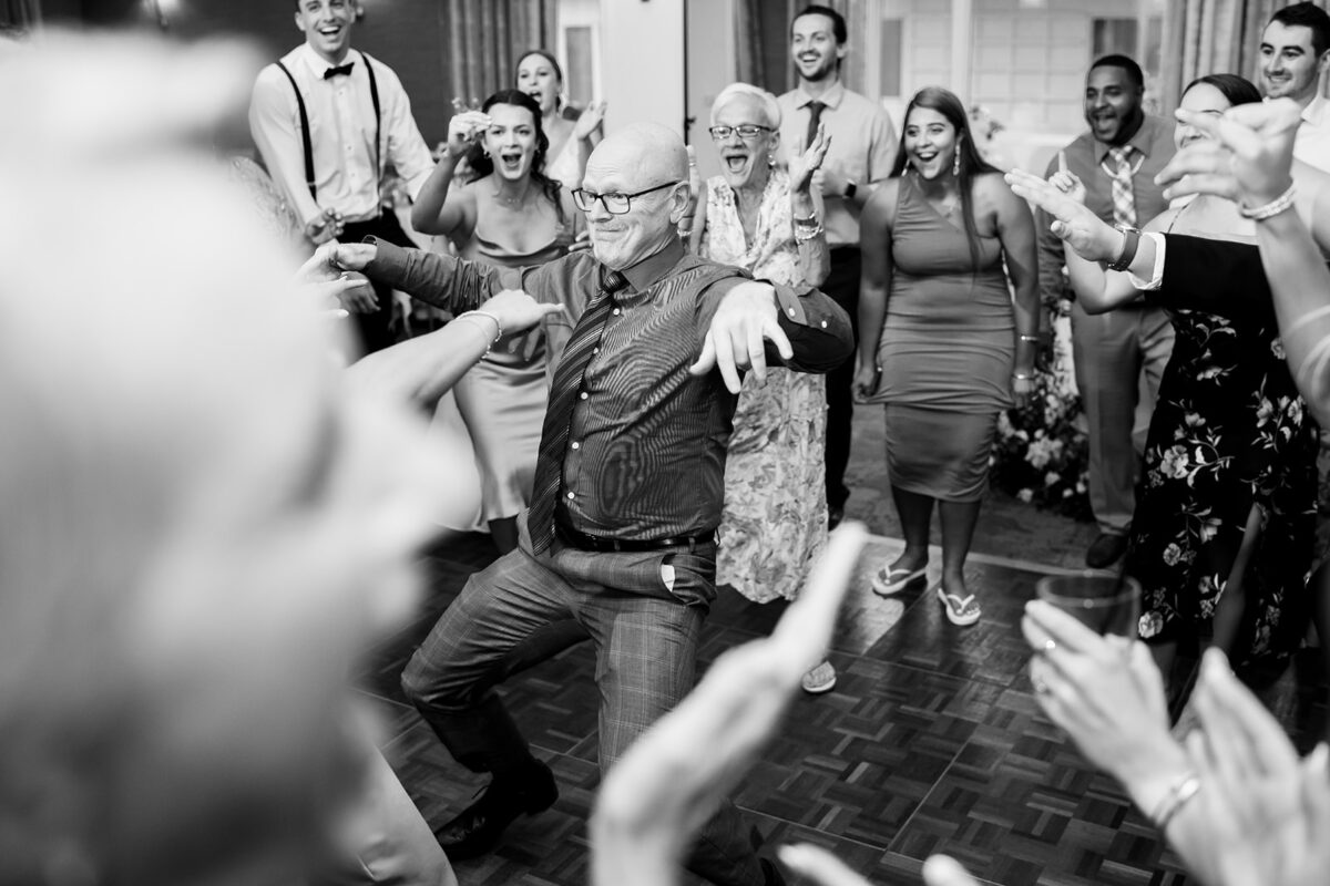 Waters Edge Wedding Venue, Westbrook CT wedding guest in dance circle at reception