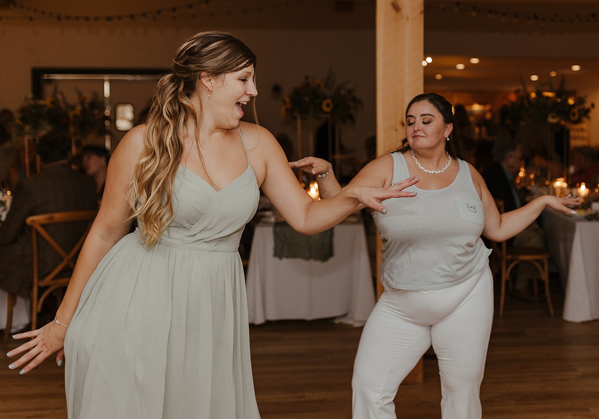 bride and bridesmaid dancing at a new york wedding reception