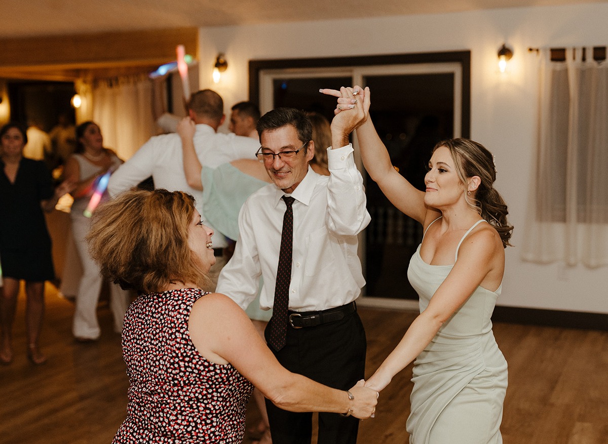 group dancing holding hands at a Magnanini Winery wedding
