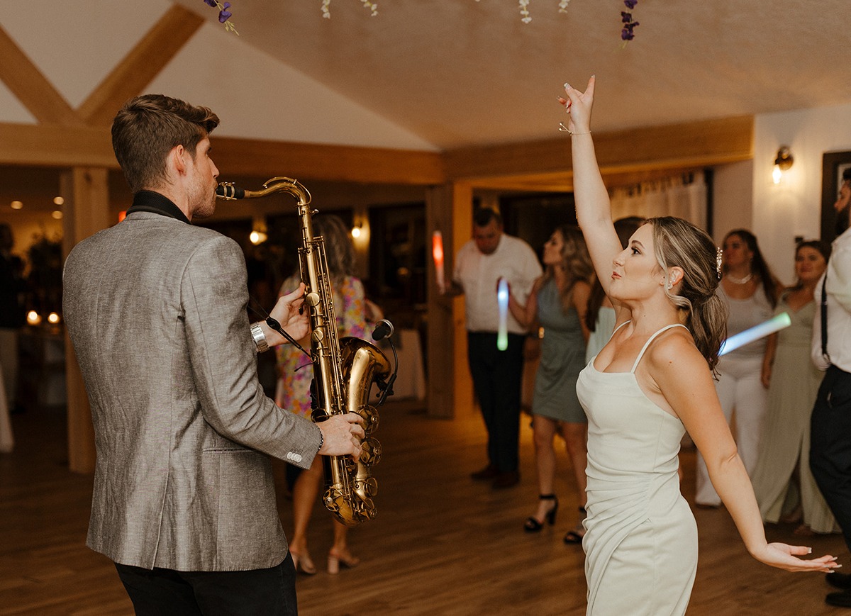 sax player and bridesmaid dancing at Magnanini Winery wedding reception