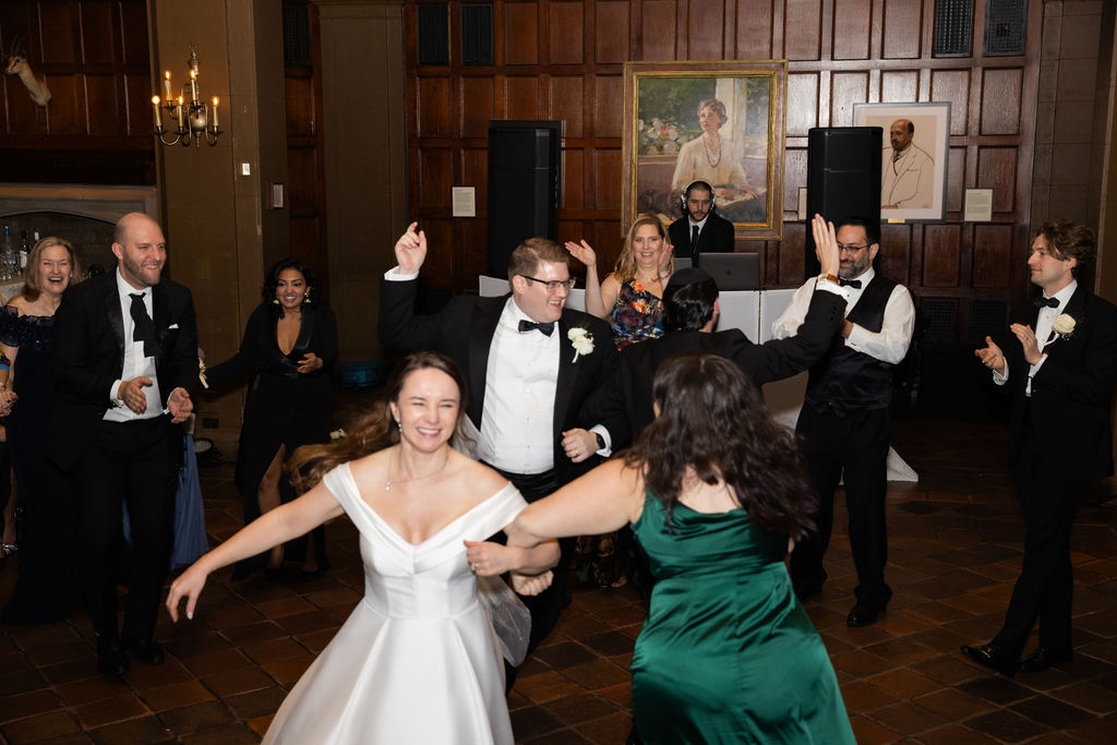 bride and bridesmaids dancing at harvard club nyc wedding
