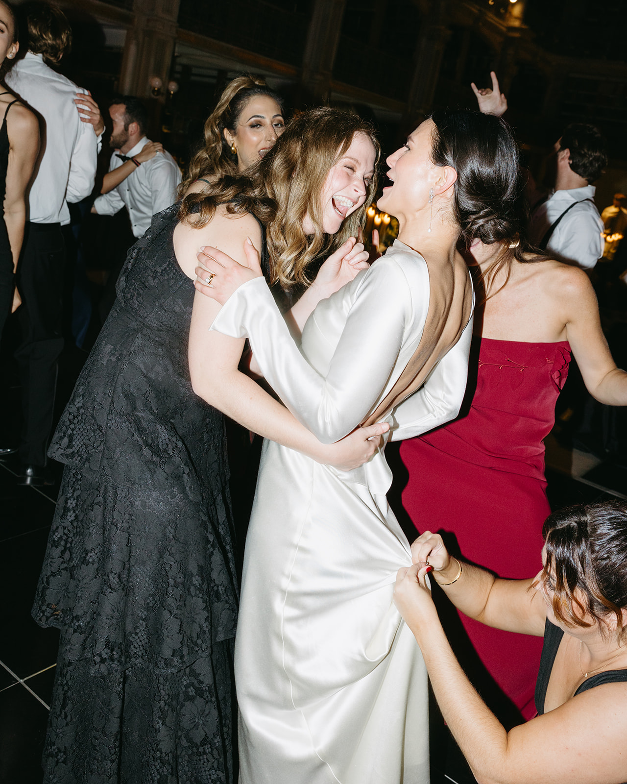 bride and group dancing at wedding at george peabody library