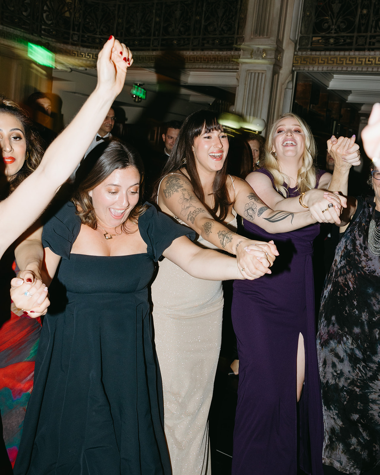 crowd dancing during wedding reception