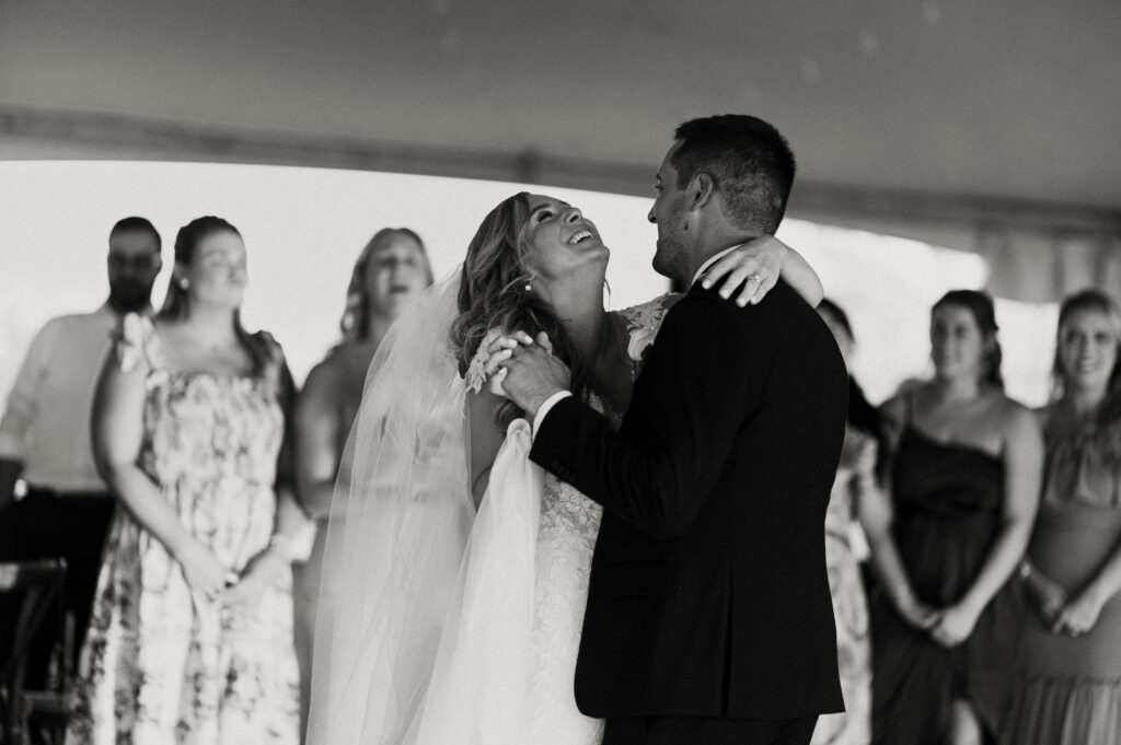 bride and groom dancing at tented wedding reception