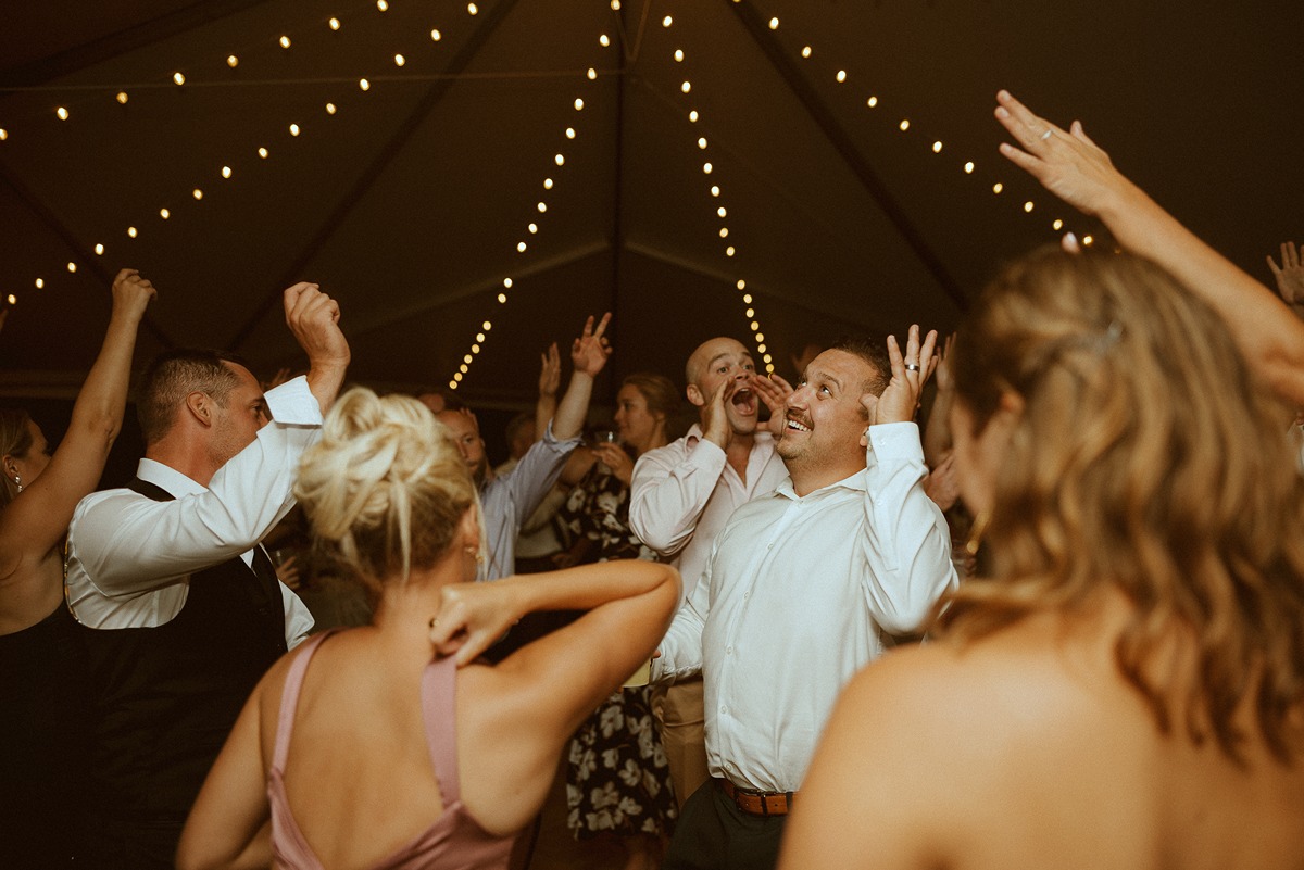 crowded dance floor at tented wedding reception new hampshire