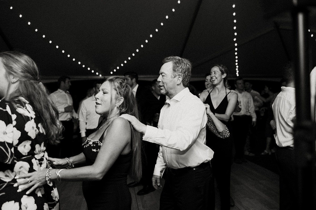 tented wedding reception new hampshire conga line on dance floor