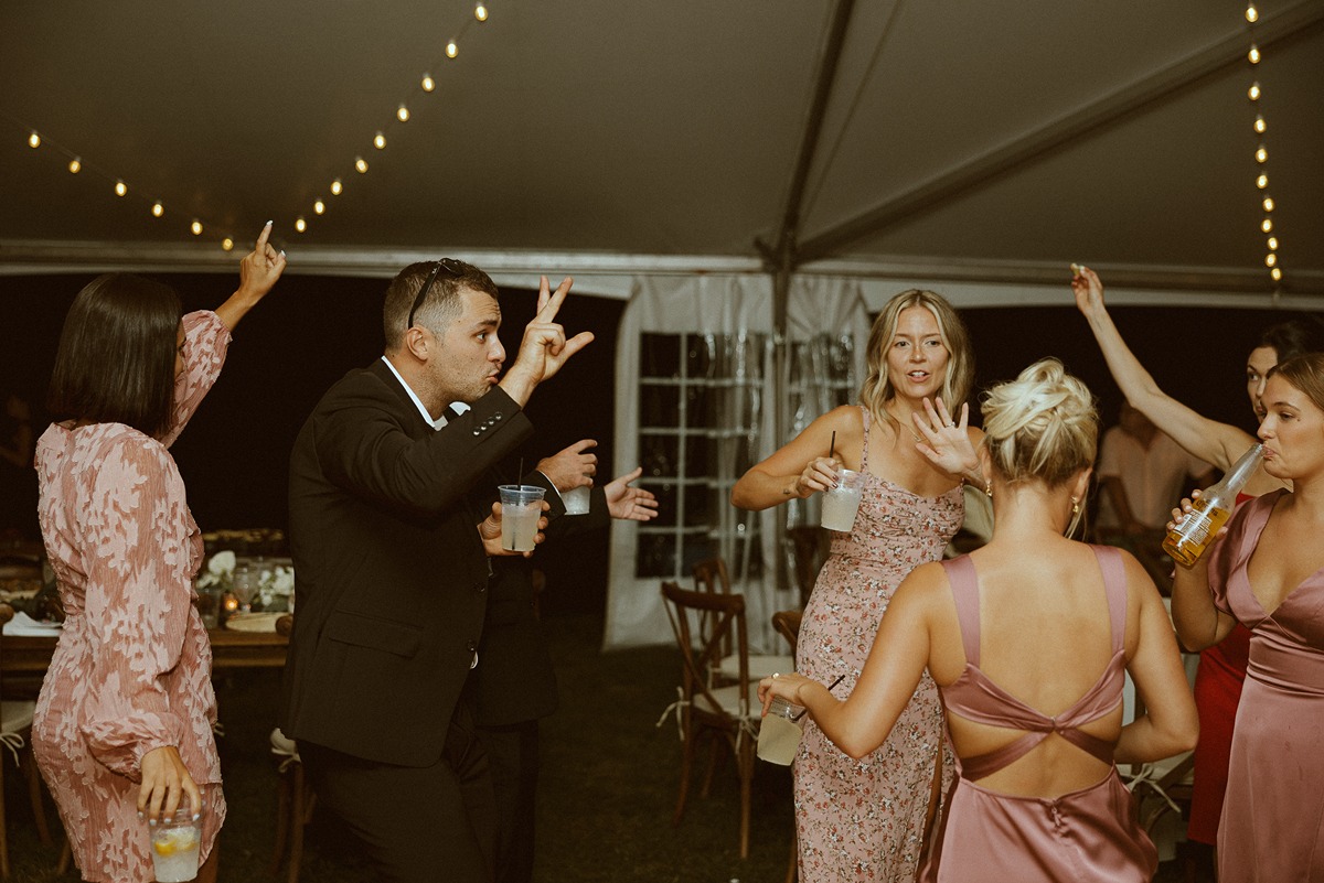 group of people dancing at tented wedding reception in new hampshire