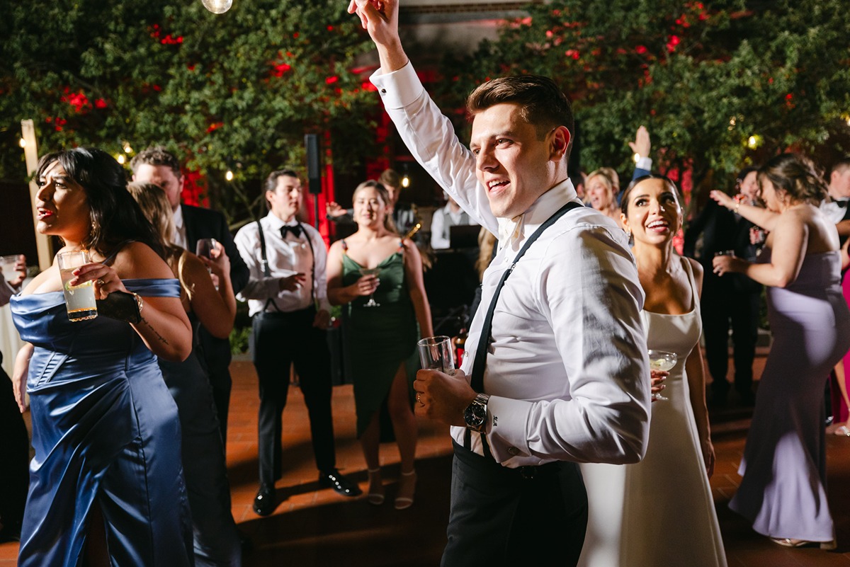 groom dancing on the dance floor at outdoor reception