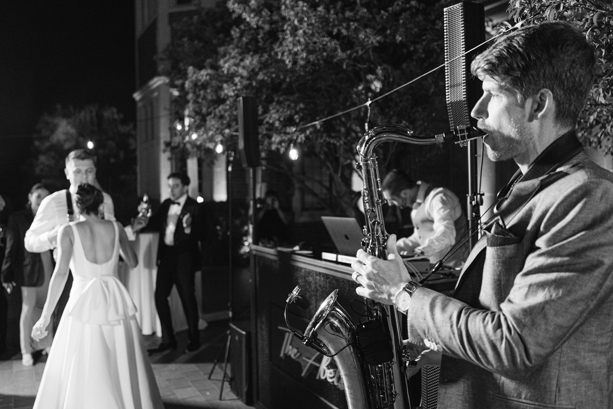 saxophone player at waveny park outdoor wedding
