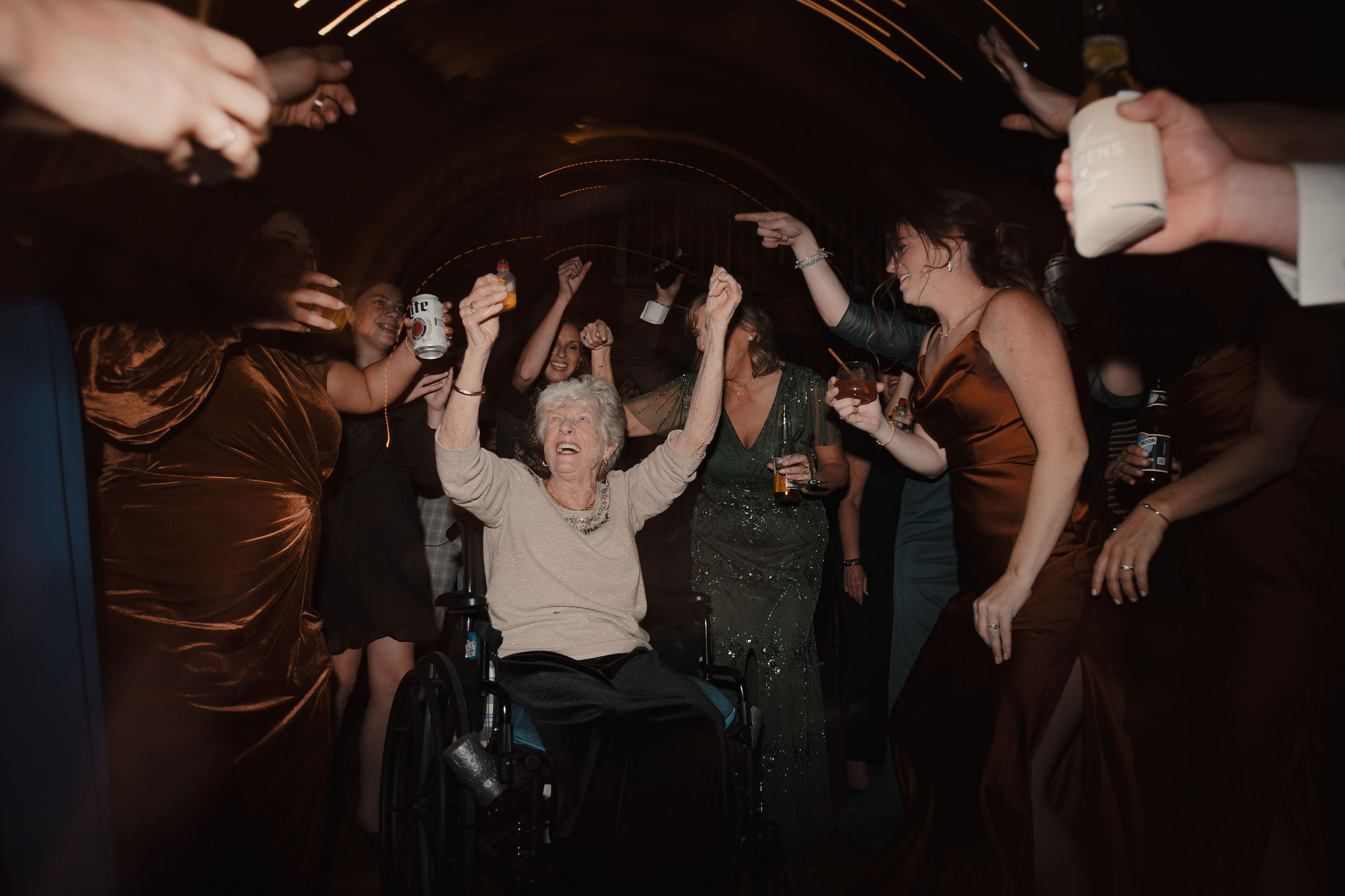 Grandma taking shot on dancefloor surrounded by dancing at The Preserve at Chocorua in Tamworth NH